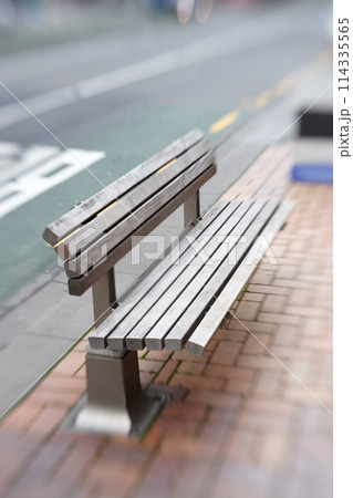 Urban, bench and seat on sidewalk in city with blurry motion for vertigo or trippy dizziness. Wood, chair and sit on street with support of government infrastructure, development or town progress Urban, bench and seat on sidewalk in city with blurry motion for vertigo or trippy dizziness. Wood, chair and sit on street with support of government infrastructure, development or town progress 114335565