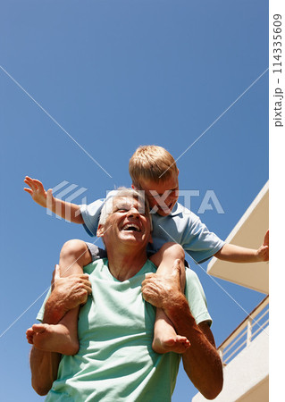 Kid, happy and on grandpa shoulder for bonding, family game or development at home flying. Parent, smiling and grandchild excited sitting on senior for summer entertainment, amusement or retirement 114335609