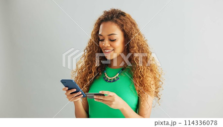 Happy woman, phone and banking with credit card for payment or online shopping on a gray studio background. Female person or shopper with smile on mobile smartphone for ecommerce on mockup space 114336078