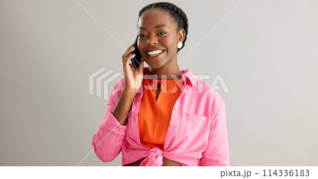 Happy, phone call and face of black woman laughing in studio with web, connection or news on grey background. Funny, portrait or female model with smartphone conversation, app or silly communication 114336183