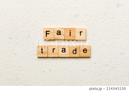 fair trade word written on wood block. fair trade text on cement table for your desing, concept 114343130