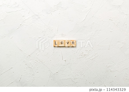 love word written on wood block. love text on table, concept love word written on wood block. love text on table, concept 114343329
