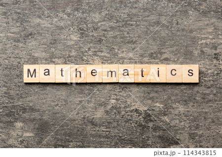 mathematics word written on wood block. mathematics text on cement table for your desing, concept 114343815