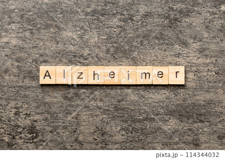 Alzheimer word written on wood block. Alzheimer text on cement table for your desing, concept Alzheimer word written on wood block. Alzheimer text on cement table for your desing, concept 114344032