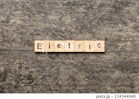 Electric word written on wood block. Electric text on cement table for your desing, concept Electric word written on wood block. Electric text on cement table for your desing, concept 114344049