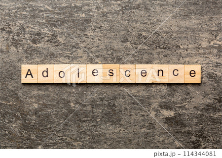 adolescence word written on wood block. adolescence text on table, concept 114344081