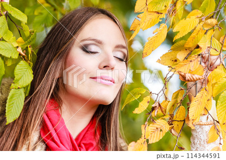 woman fashion girl relaxing walking in autumnal park woman fashion girl relaxing walking in autumnal park 114344591