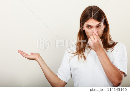 Man with odor of sweat Man with odor of sweat 114345160