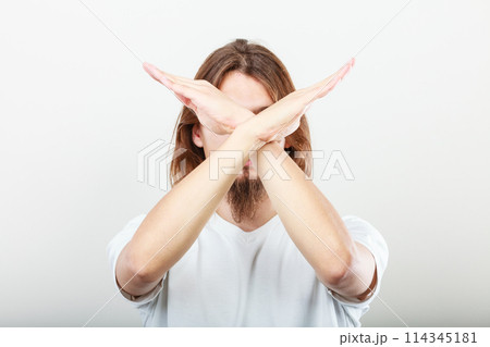 Man making stop sign Man making stop sign 114345181