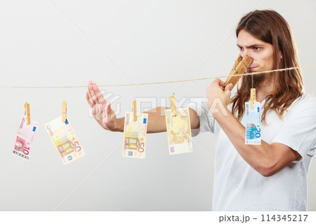 Young man sick of money Young man sick of money 114345217