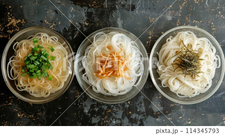 Shirataki noodles with vegetables in glass bowl on table, top view 114345793