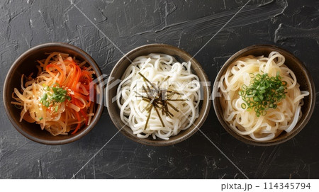 Japanese Shirataki noodles in bowls on black background. 114345794