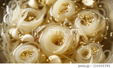 Close up of a bowl of Asian shirataki noodle with sesame seeds. 114345795
