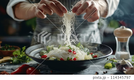Chef preparing shirataki noodle in the kitchen. 114345797
