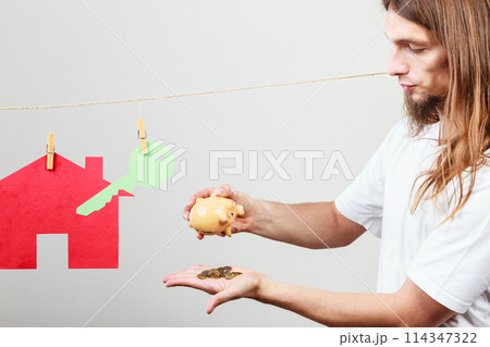 Man seller with money and house 114347322