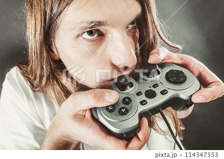 Male player focus on play games Male player focus on play games 114347353