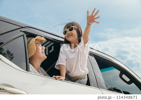 Happy family day. Asian Dad, mom and daughter little kid smiling sitting in compact car windows raise hand wave goodbye, Summer at beach, Car insurance, Family holiday vacation travel, road trip Happy family day. Asian Dad, mom and daughter little kid smiling sitting in compact car windows raise hand wave goodbye, Summer at beach, Car insurance, Family holiday vacation travel, road trip 114348671