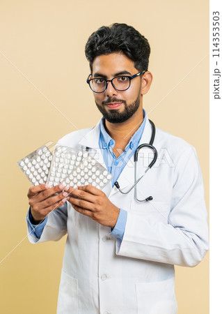 Indian doctor man show lot of tablet pills in blisters recommends drugs vitamin antibiotic treatment Indian doctor man show lot of tablet pills in blisters recommends drugs vitamin antibiotic treatment 114353503