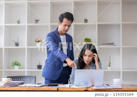 A young accountant feels stressed from being pressured by her supervisor while her work is having a difficult time. A young accountant feels stressed from being pressured by her supervisor while her work is having a difficult time. 114355164