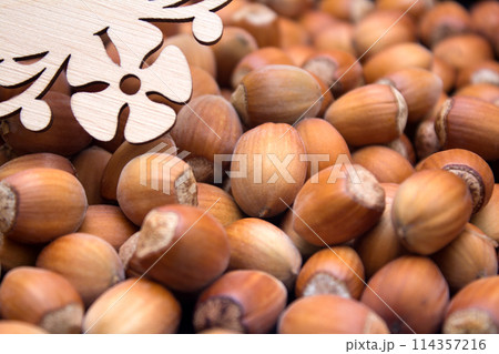 Many peeled hazel nuts - background of nature 114357216