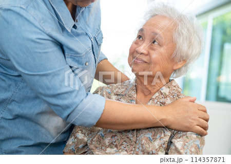 Caregiver help and care Asian senior woman patient with love, encourage and empathy in hospital. 114357871