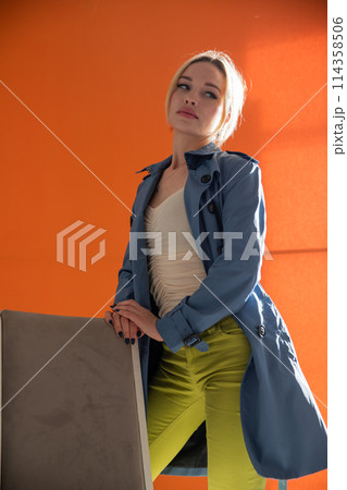 Beautiful fashionable woman in autumn raincoat 114358506