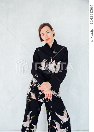 Portrait of a beautiful fashionable woman in a summer suit 114358564