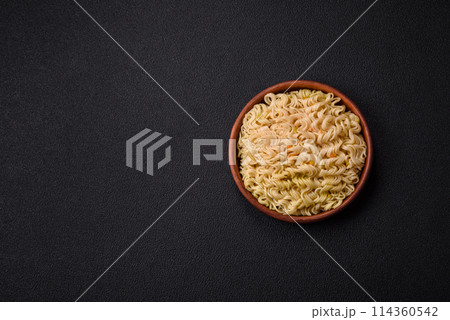 Delicious Asian dish rice noodles or udon with vegetables, spices and herbs 114360542