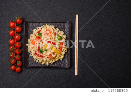 Delicious Asian dish rice noodles or udon with vegetables, spices and herbs 114360566