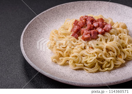 Delicious Asian dish rice noodles or udon with vegetables, spices and herbs 114360571