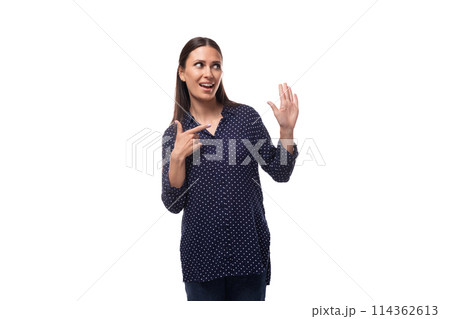 young european slim brunette woman in blue clothes looks confident on a white background 114362613