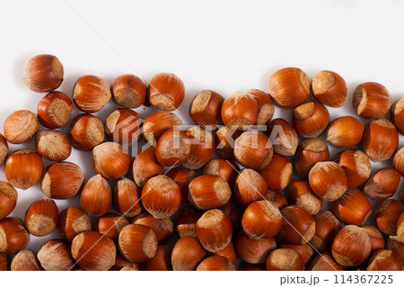 Raw filberts on white background Raw filberts on white background 114367225