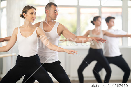 Young man and young woman rehearsing pair ballet Young man and young woman rehearsing pair ballet 114367450