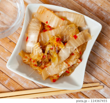 Traditional Korean dish, kimchi, served on table 114367455
