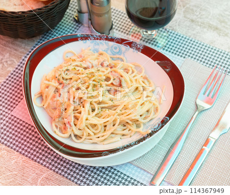 Spaghetti alla carbonara. Pasta with pancetta, parmesan cheese and cream sauce closeup 114367949