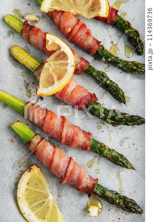 Asparagus baked with bacon Asparagus baked with bacon 114369736