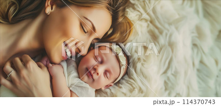 Woman Holding Newborn Baby 114370743