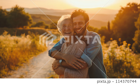 Man and Woman Hugging in Field 114370744