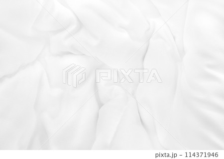 Close up top view of white bedding sheet and wrinkle messy blanket in bedroom after wake up in the morning. 114371946