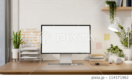 A contemporary minimalist home office features a computer mockup against a white rustic brick wall. A contemporary minimalist home office features a computer mockup against a white rustic brick wall. 114371962
