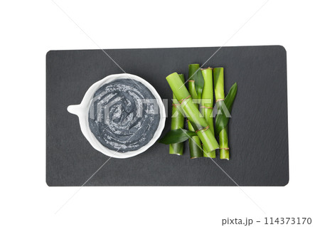 PNG,Fresh bamboo shoots with charcoal in the form of a paste, isolated on white background PNG,Fresh bamboo shoots with charcoal in the form of a paste, isolated on white background 114373170