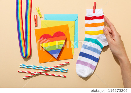 LGBT parade concept, free love symbol on light background. LGBT parade concept, free love symbol on light background. 114373205