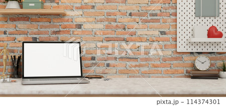A minimal vintage doctor's office desk features a laptop computer against the rustic brick wall. A minimal vintage doctor's office desk features a laptop computer against the rustic brick wall. 114374301