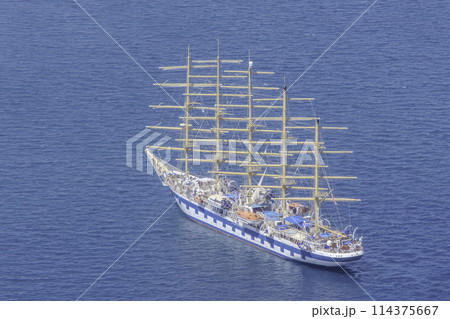 Greece, Santorini, Fira, sailing boat, five masts in the Aegean Sea Greece, Santorini, Fira, sailing boat, five masts in the Aegean Sea 114375667
