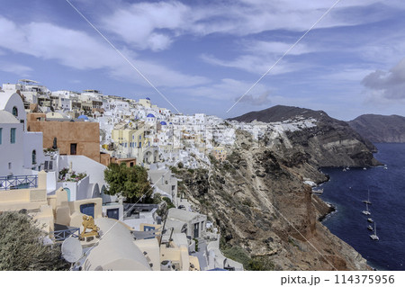 Greece, Santorini, Oia, Traditional houses of the village with blue dome Greece, Santorini, Oia, Traditional houses of the village with blue dome 114375956