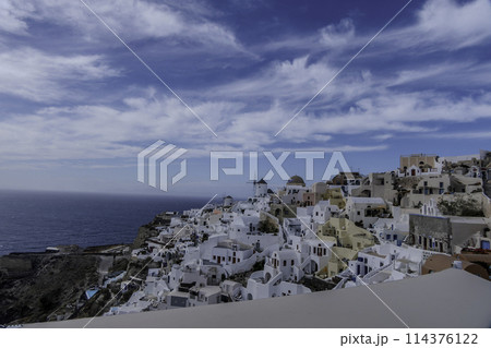 Greece, Santorini, Oia, view of the village with windmills 114376122