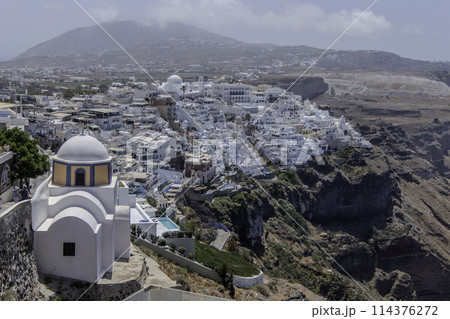 Greece, Santorini, Fira, Landscape of the capital with the Church of Saint Stylianos 114376272