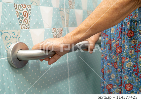 Asian elderly woman use bathroom handle security in toilet, healthy strong medical concept. Asian elderly woman use bathroom handle security in toilet, healthy strong medical concept. 114377425