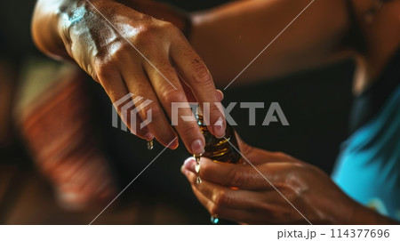 Two Hands Exchanging a Medicine Bottle 114377696