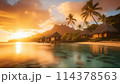 夕焼けに染まる雲と水上コテージ 114378563